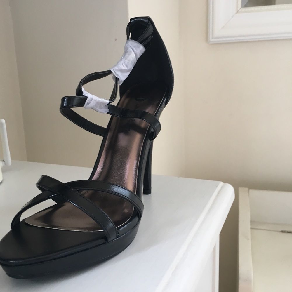 Brand New! Black strappy heels. Price is firm